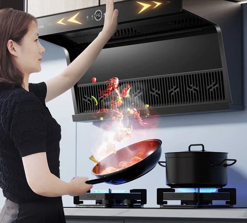 A hand swung under the V996 while a wok is going