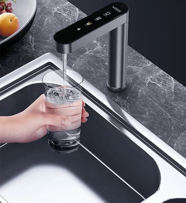 A glass being filled at the tap