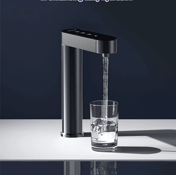 The tap running into a glass on a counter